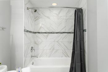 Bathroom with a bathtub and curtain